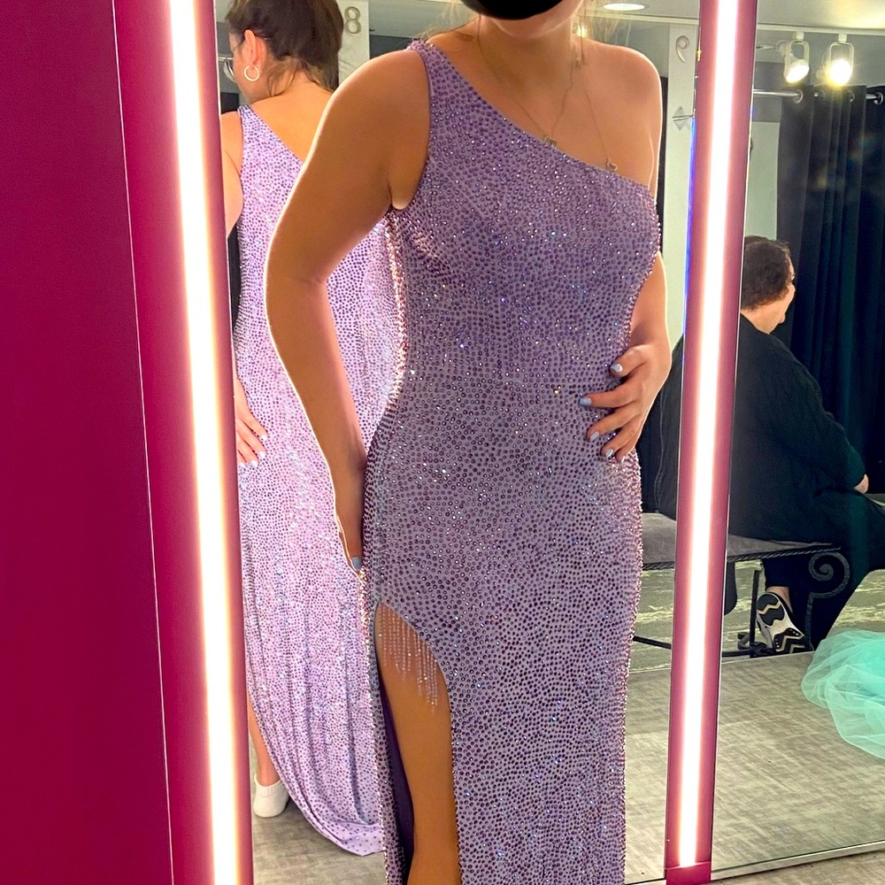 Beautiful one shoulder, sparkly gem covered with beading detail at leg.